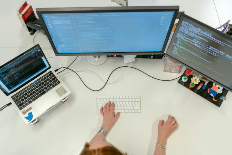 Tablet and smartphone showing analytics dashboards for multi-device engagement metrics