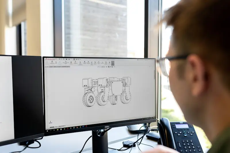 Industrial engineer reviewing technical specifications during B2B product selection