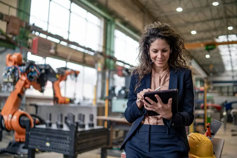 Manufacturing engineer researching technical product information during equipment evaluation.