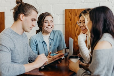 four people laughing