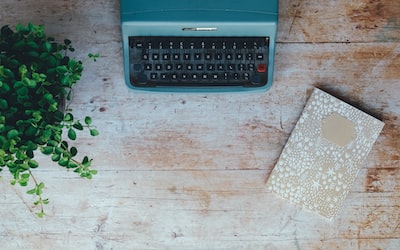 typewriter and notepad on a table